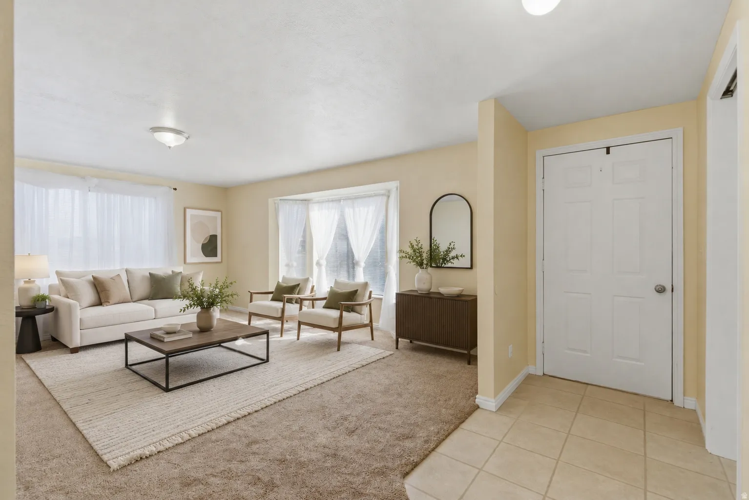 Virtually Staged - Spacious living area featuring a large bay window, recessed lighting, and soft carpet flooring - Staged