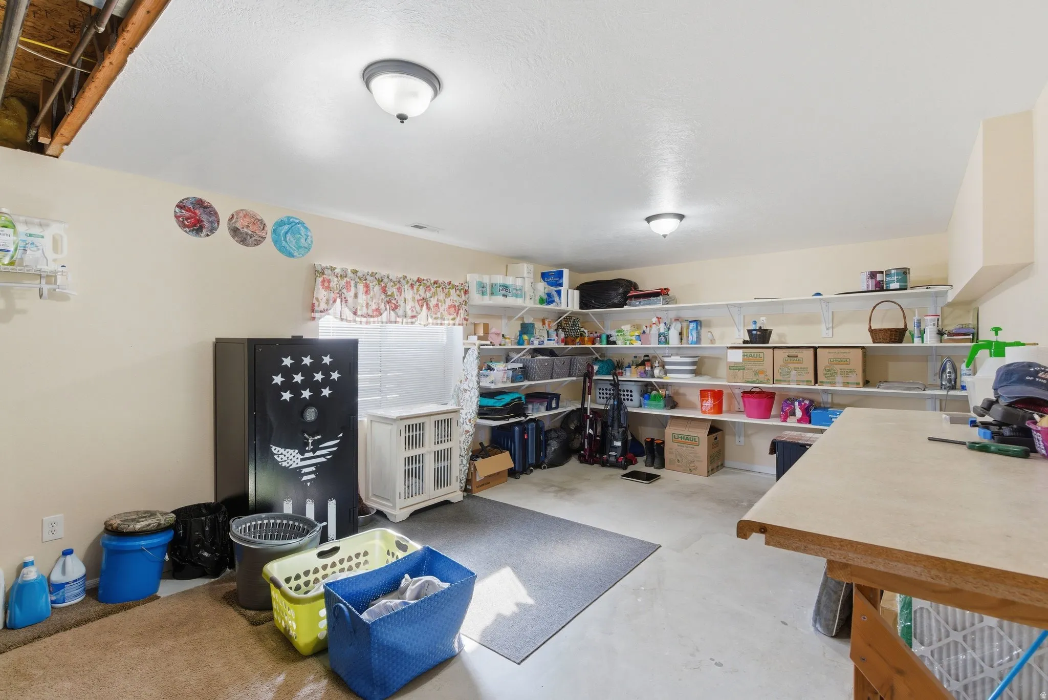 If you want a lot of storage space.  Plenty of room for a second kitchen- Notice walls are finished and painted.