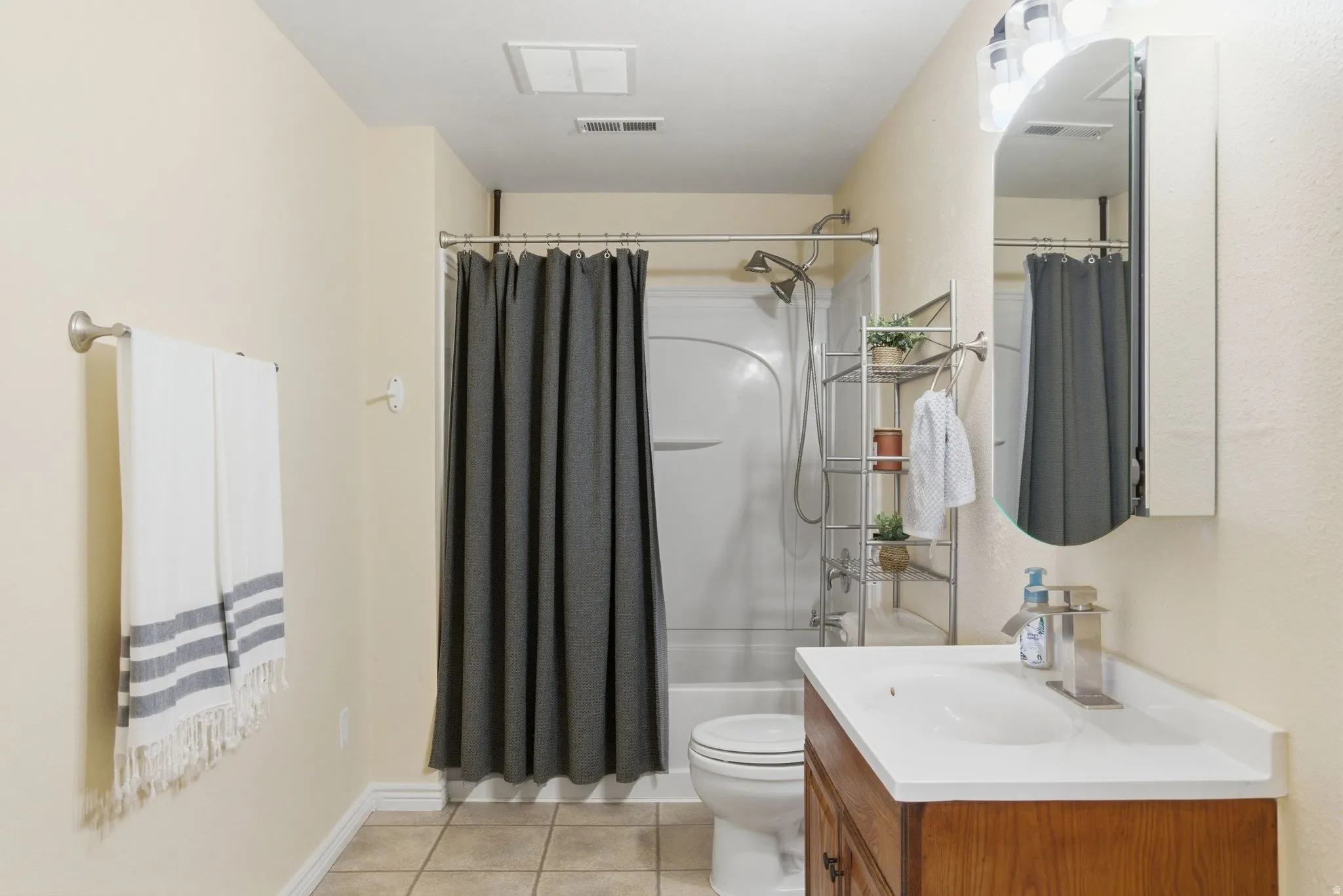 View 2 - The bathroom has plenty of room and a shower/tub combo