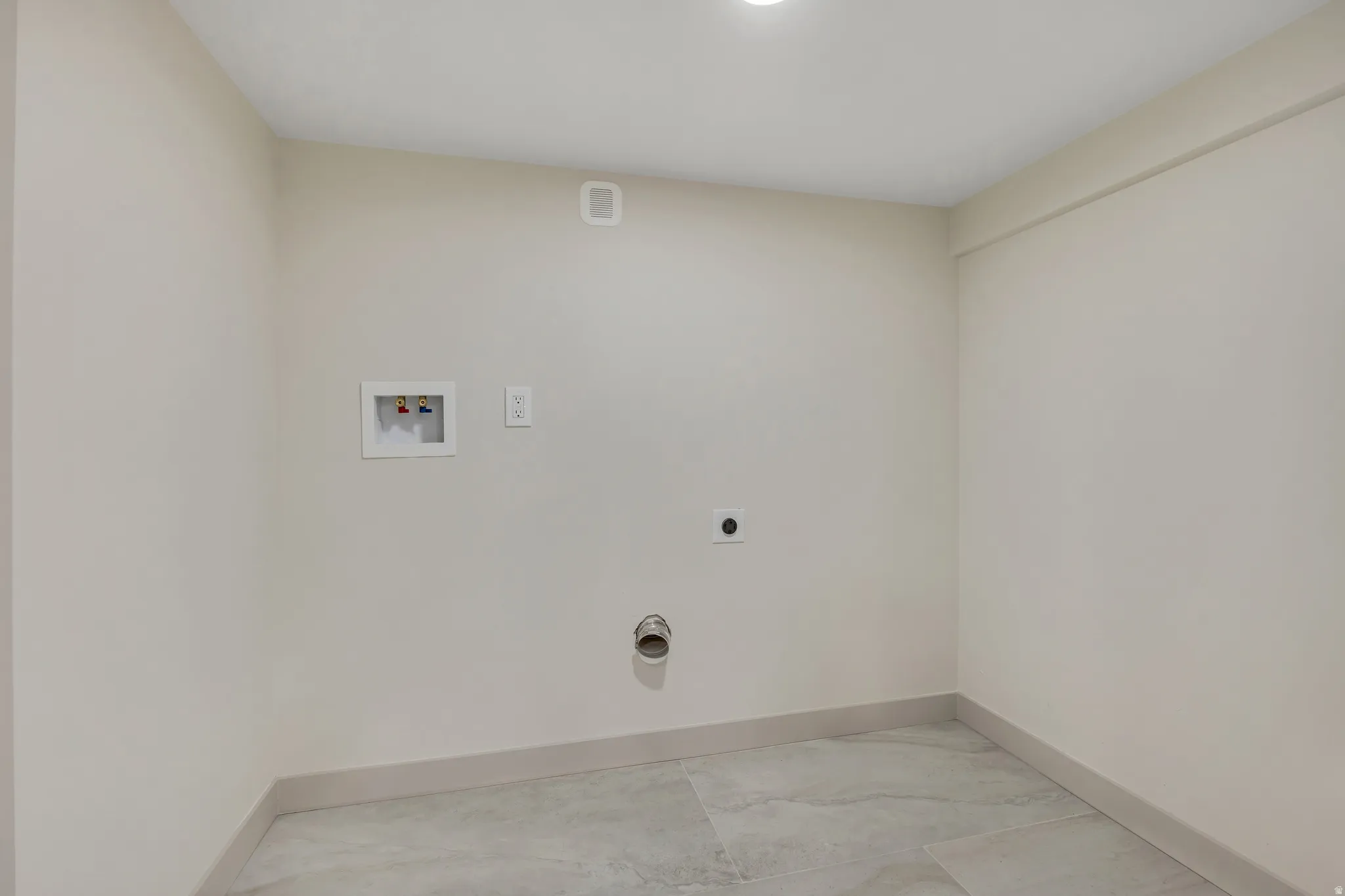 Laundry area featuring hookup for a washing machine and hookup for an electric dryer