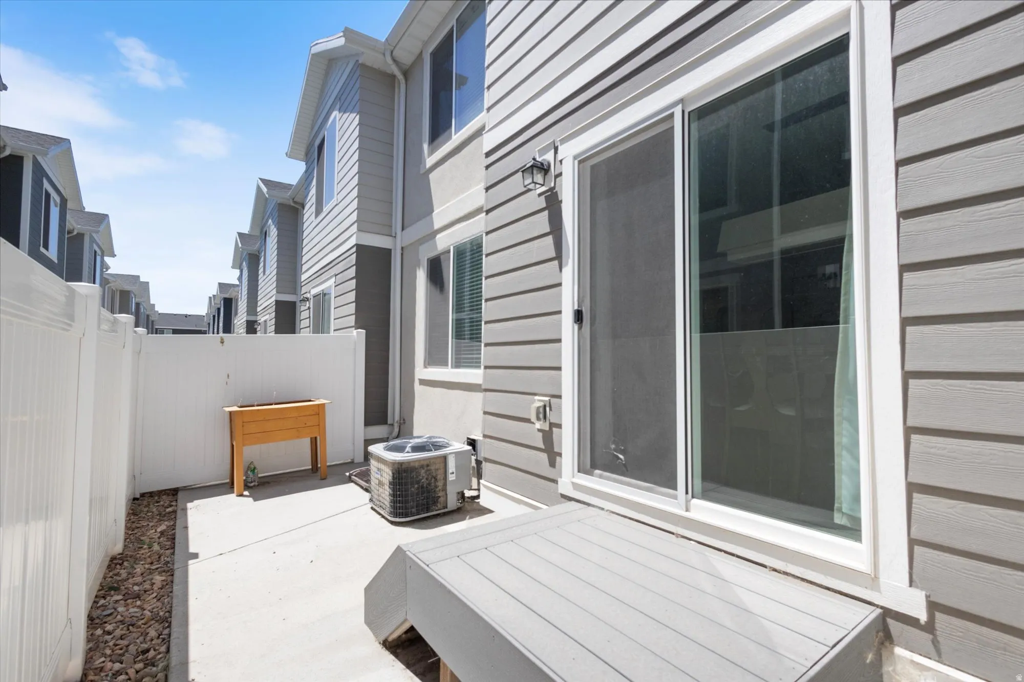 Fenced backyard featuring a patio