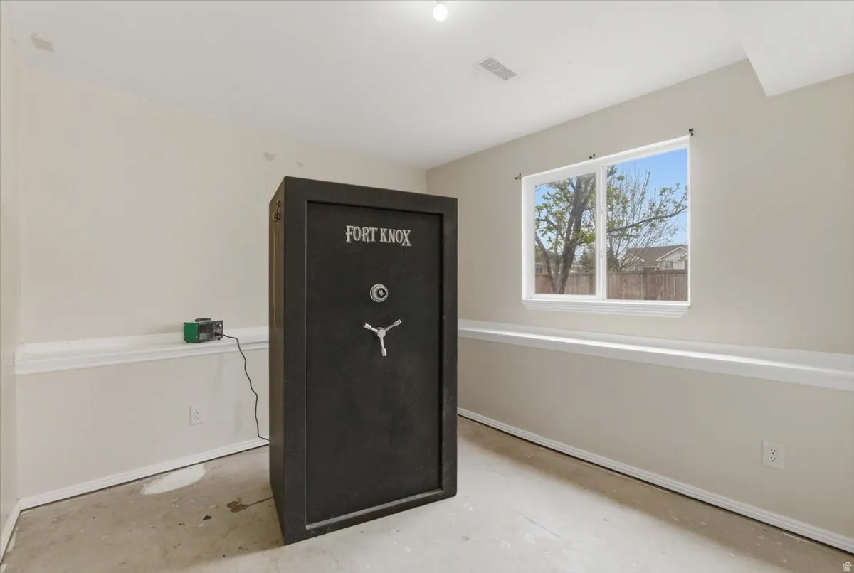 Detailed view of concrete flooring and baseboards