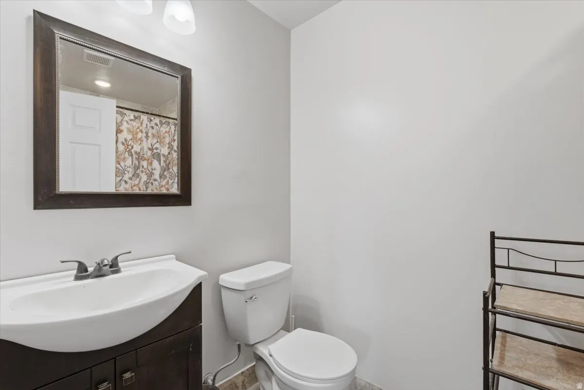 Full bathroom with vanity and a shower with curtain