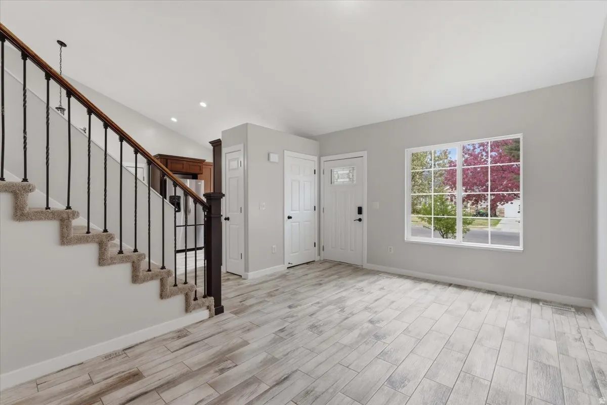 Entryway featuring wood tiled floors and recessed lighting