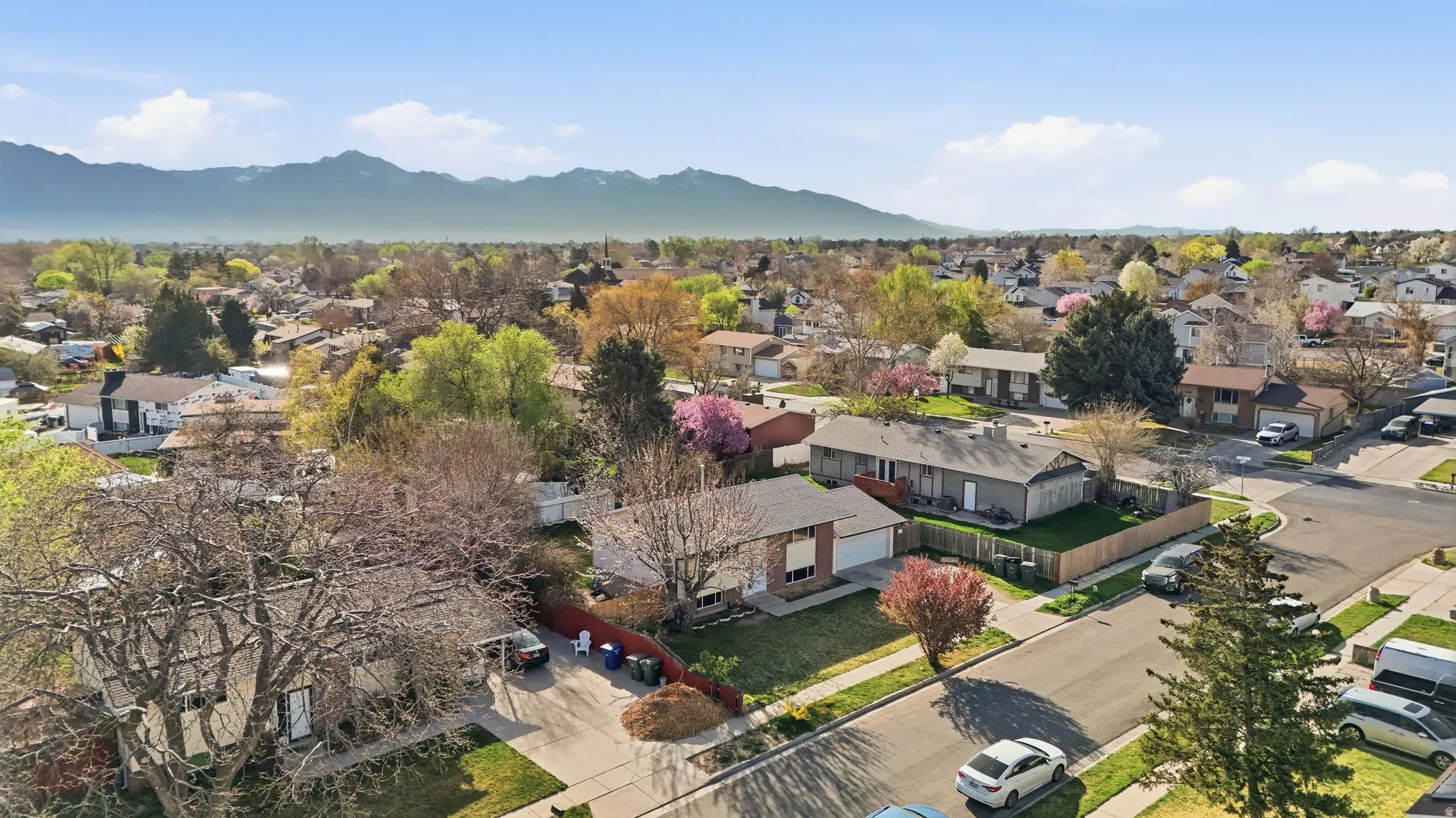 Aerial view of residential area featuring mountains