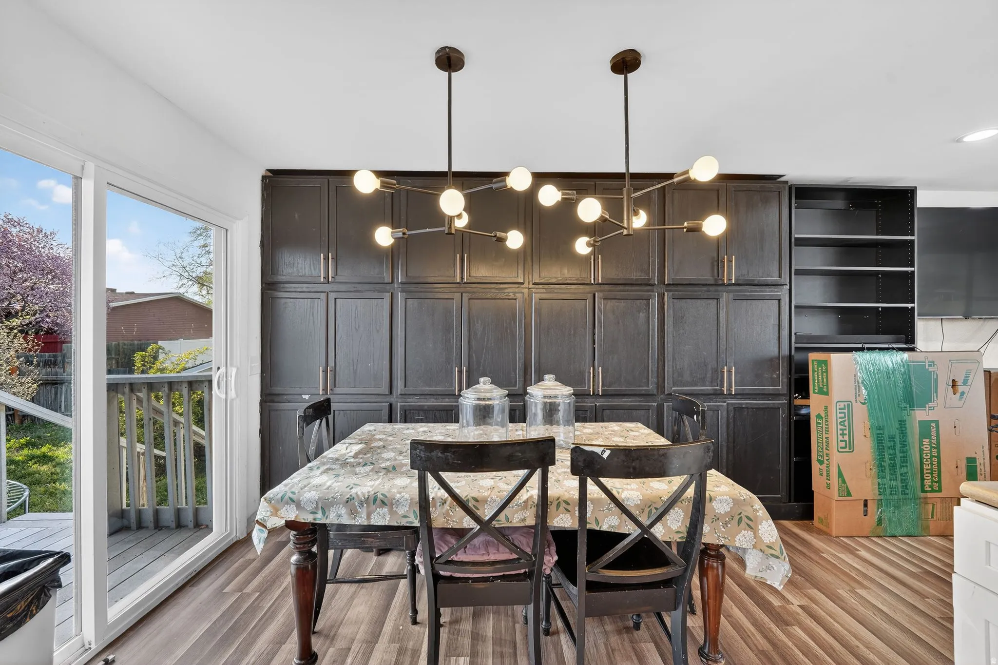 Dining room featuring light wood-style floors and suspended lighting