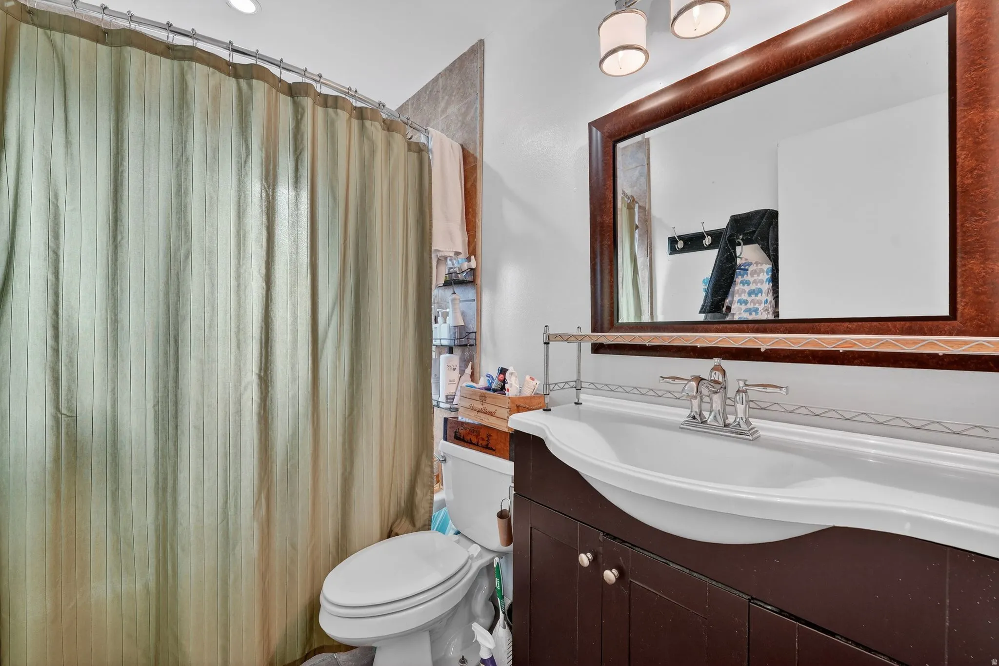 Bathroom featuring vanity and a shower.