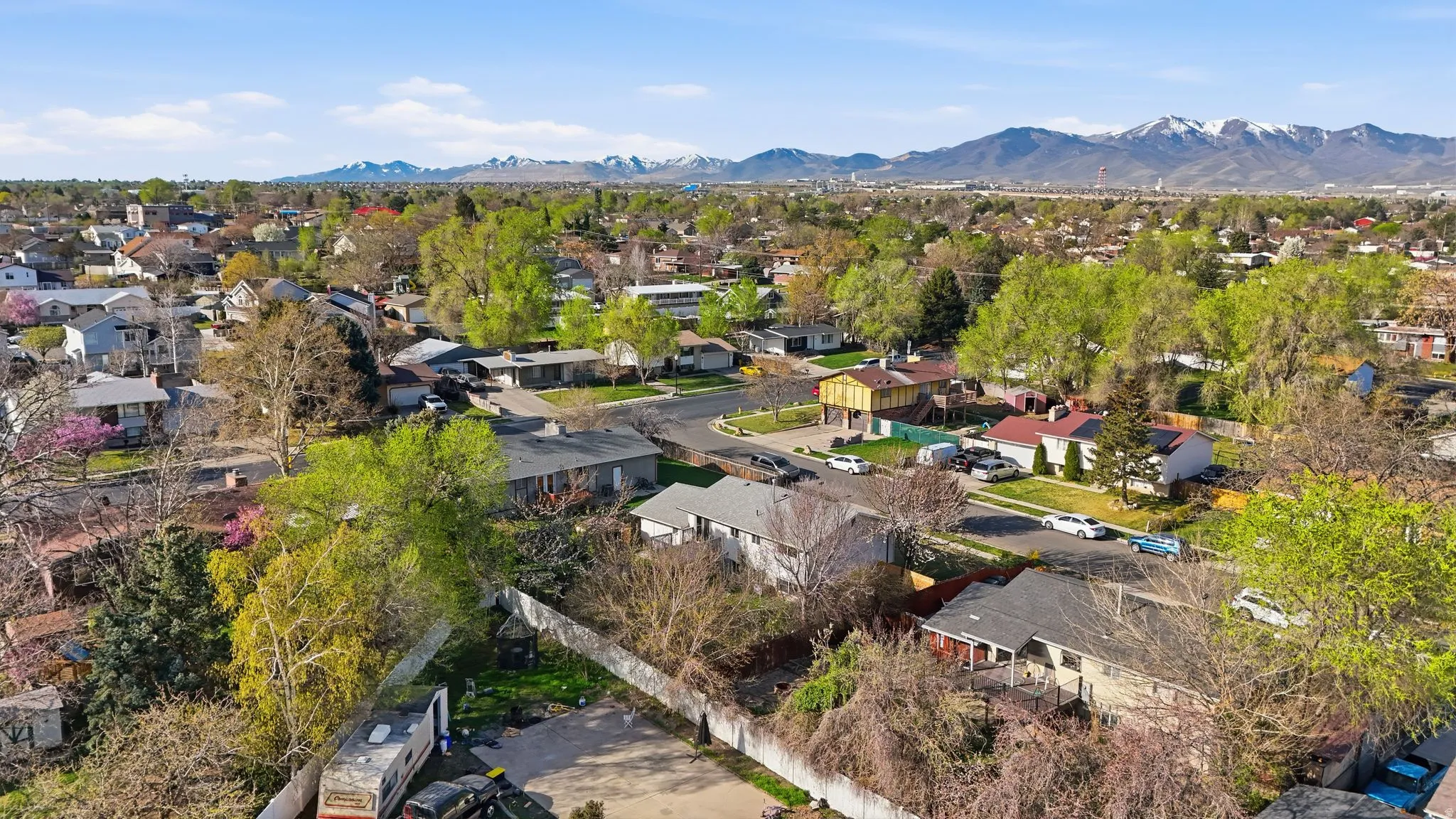 Aerial view of residential area featuring a mountainous background
