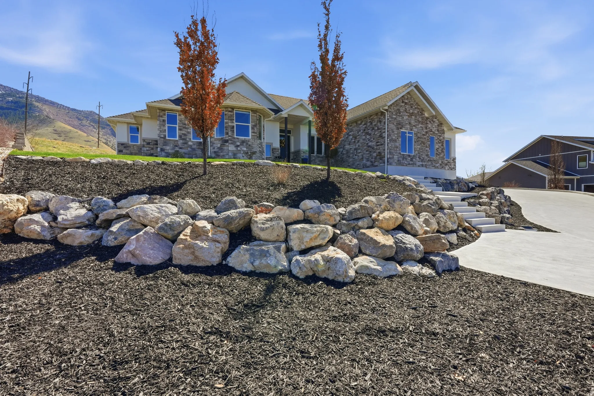 View of front of property featuring stone siding