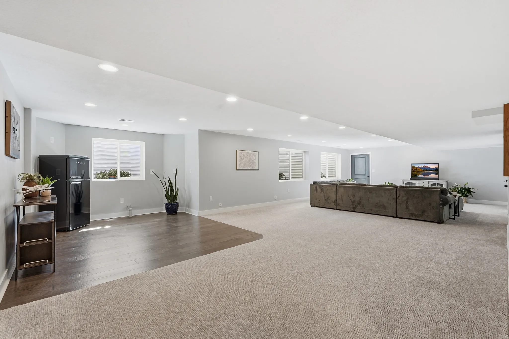Basement living room with area stubbed for 2nd kitchen