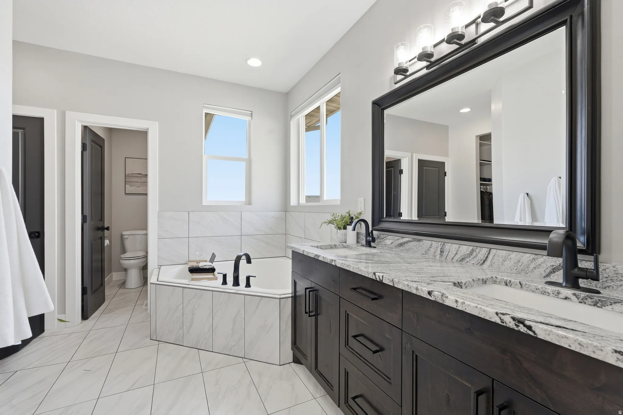 Primary bath with double vanity and a soaker tub