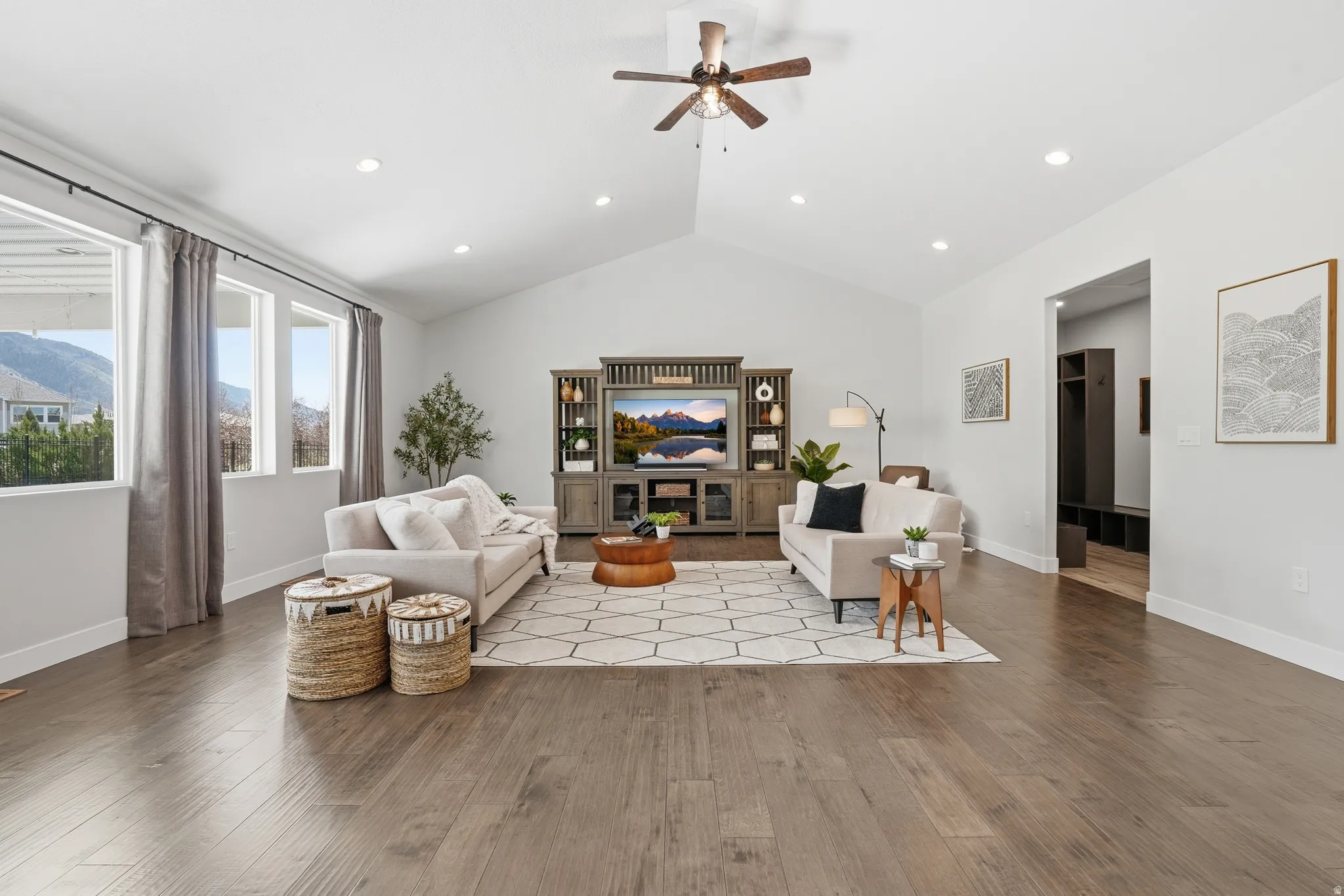 Living area featuring ceiling fan, wood finished floors, recessed lighting, and a mountain view