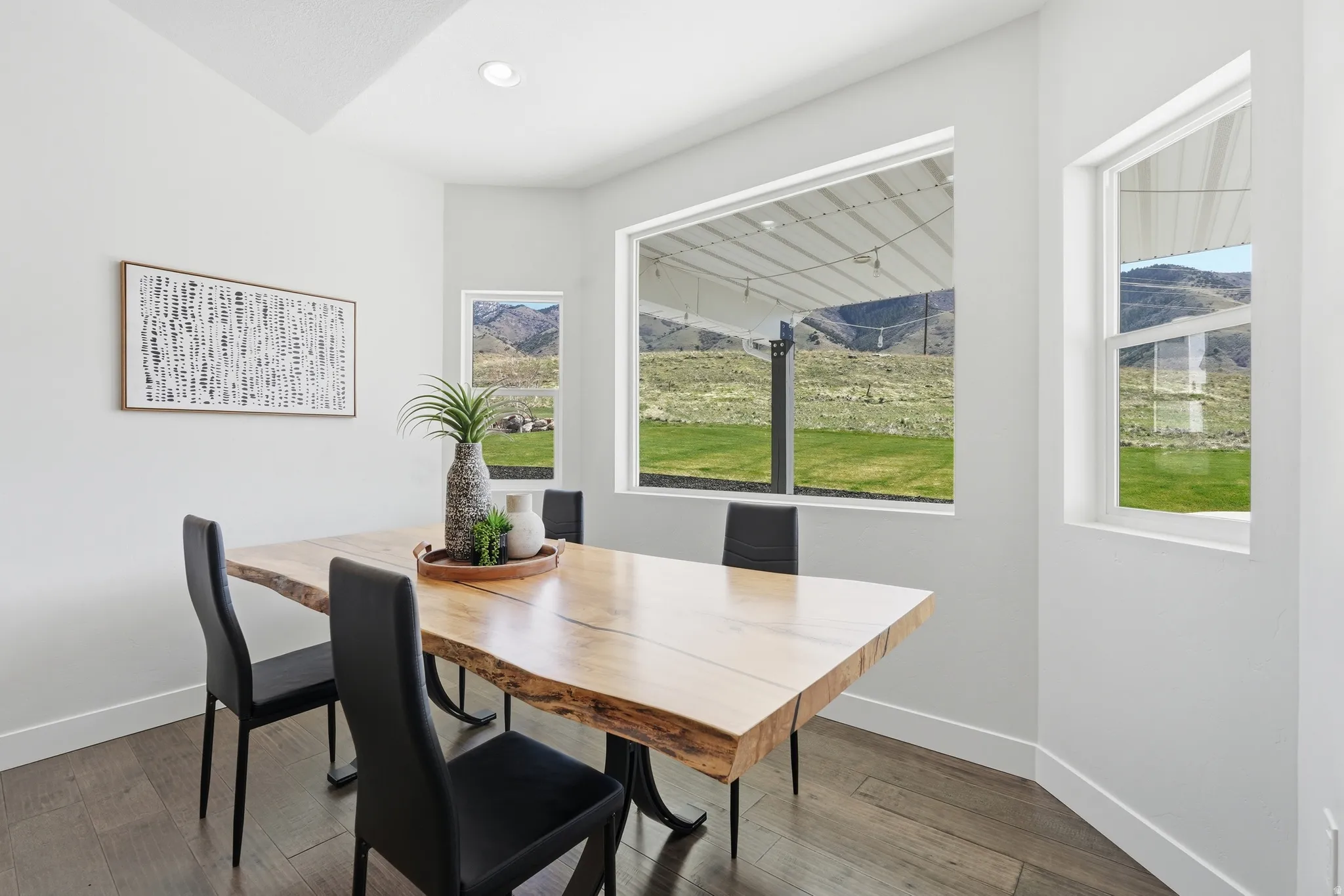 Dining area featuring hardwood floors and plenty of natural light