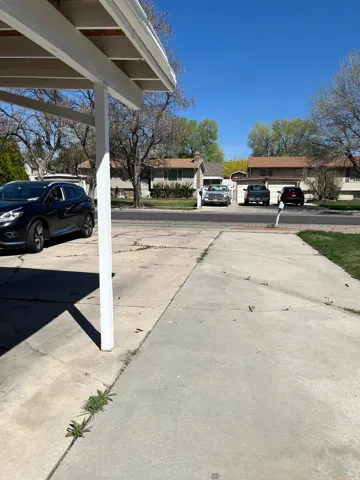 View of vehicle and RV parking featuring a residential view
