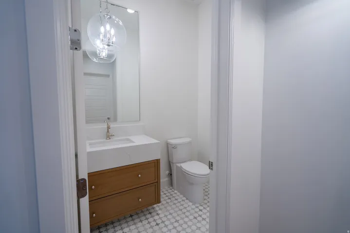 Bathroom featuring vanity and a chandelier