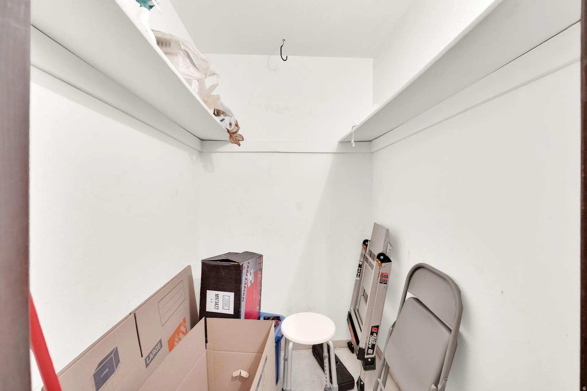 Private storage closet in hall.