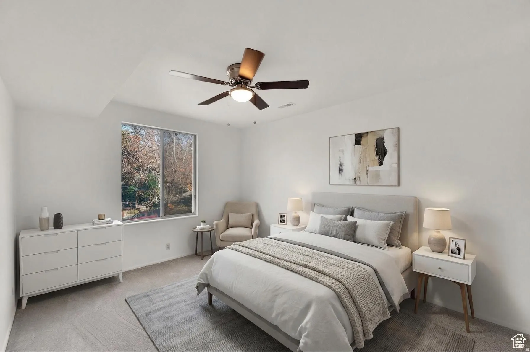 Bedroom with carpet flooring and ceiling fan and 2 closets