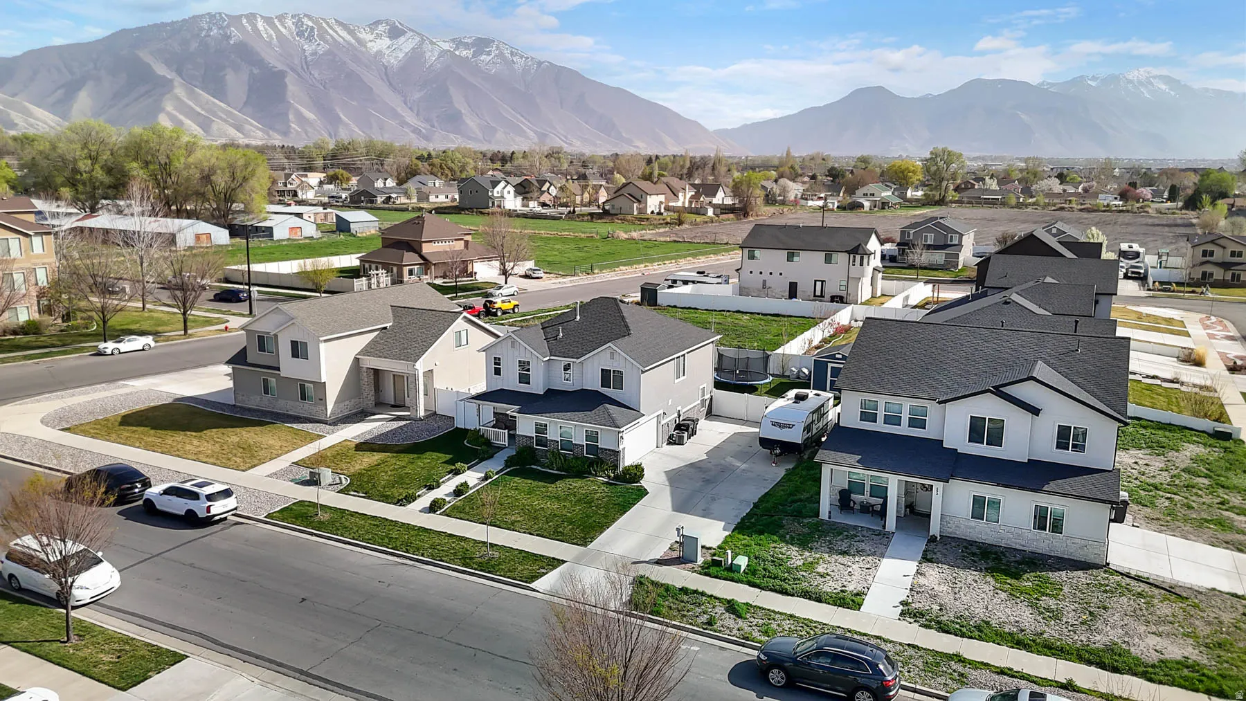 Aerial perspective of suburban area with a mountainous background
