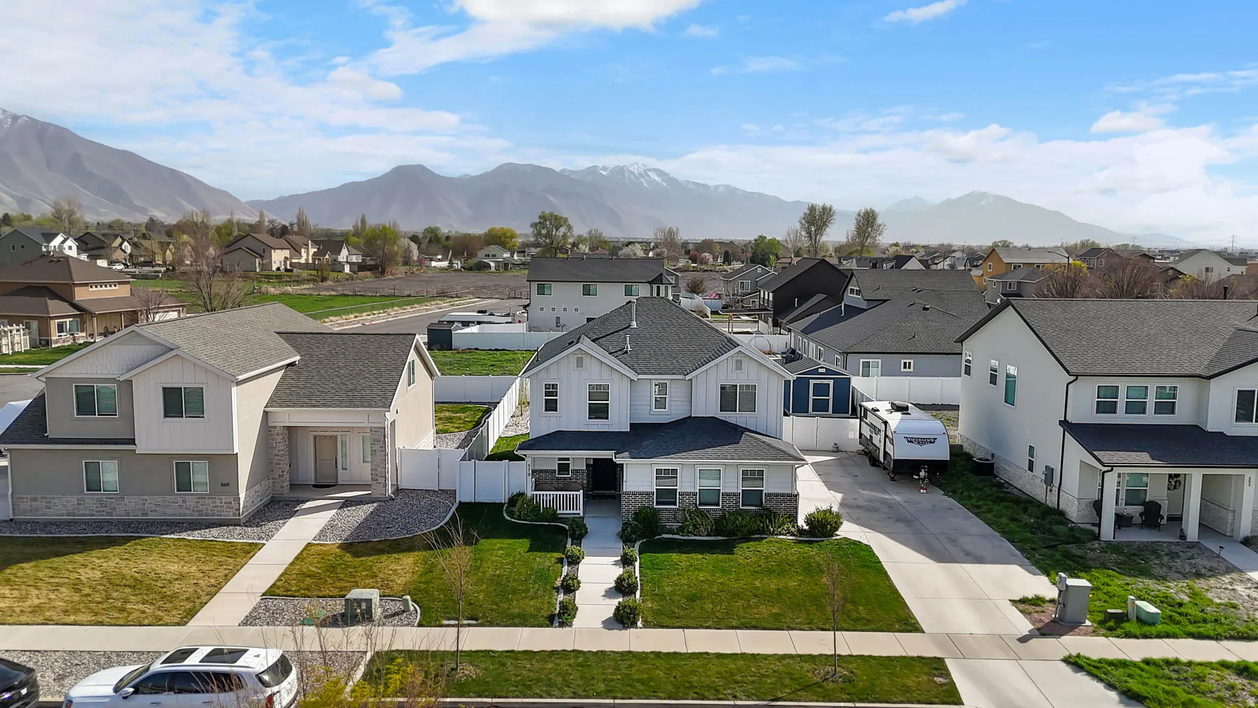 Aerial view of residential area featuring a mountain backdrop