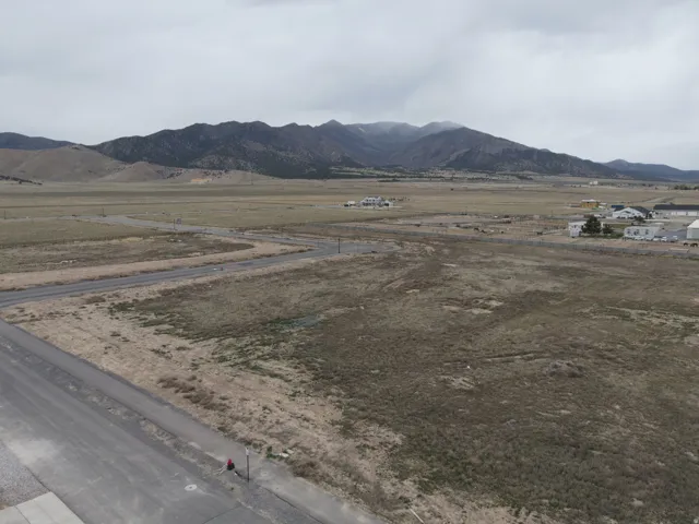 View of mountain backdrop featuring rural landscape