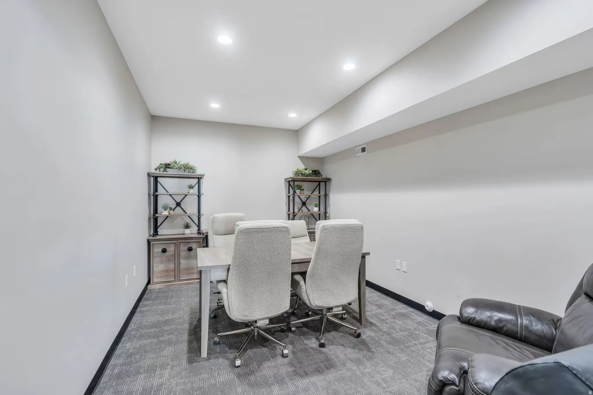 Dining area featuring carpet flooring and recessed lighting
