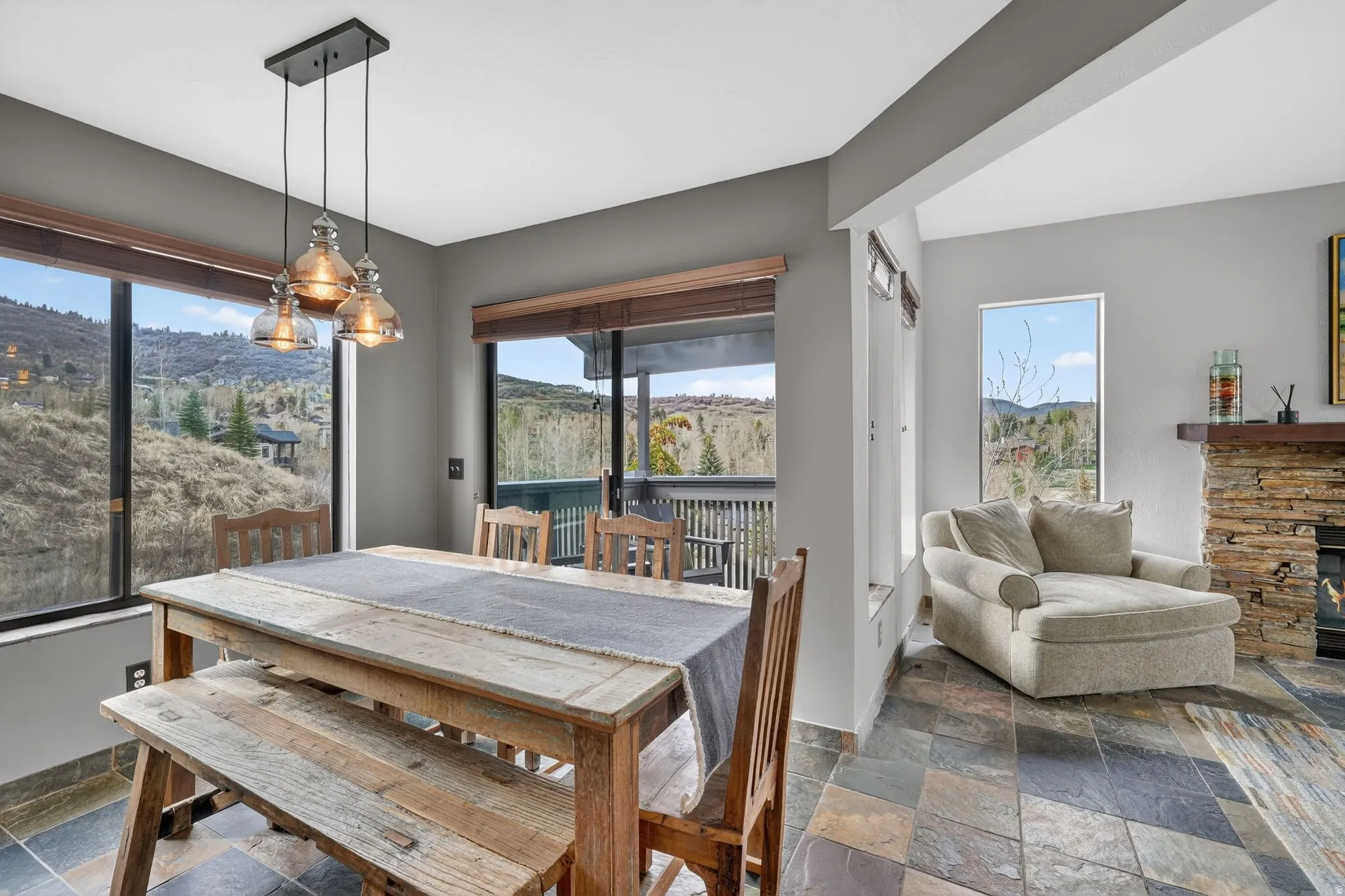 Dining space with stone tile floors and a mountain view