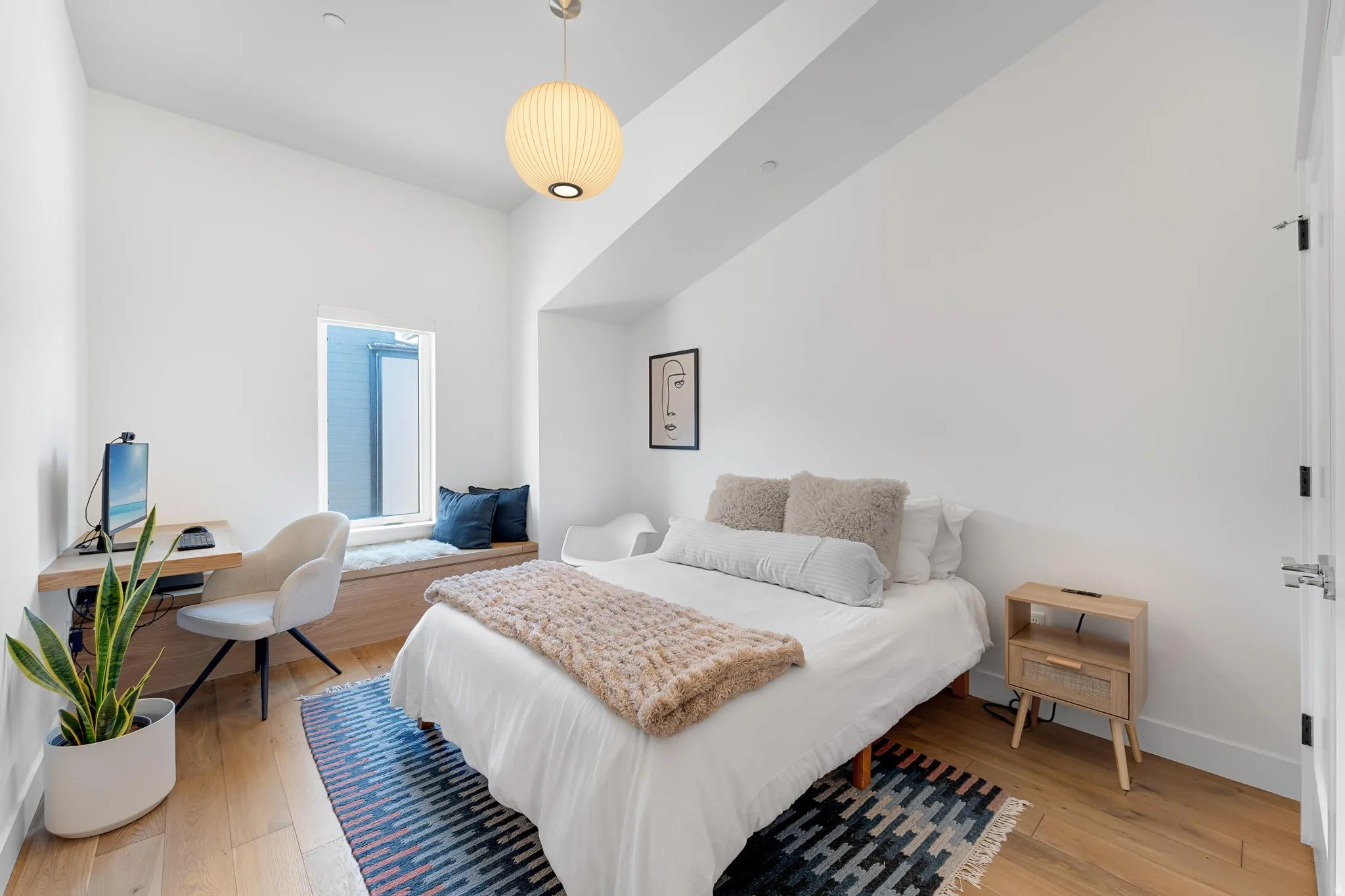 Bedroom featuring light wood finished floors and baseboards