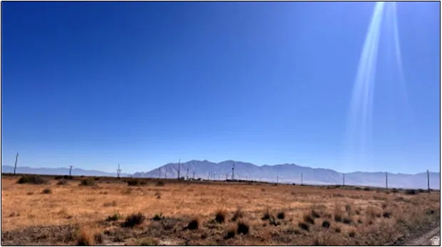 View of mountain backdrop featuring rural landscape