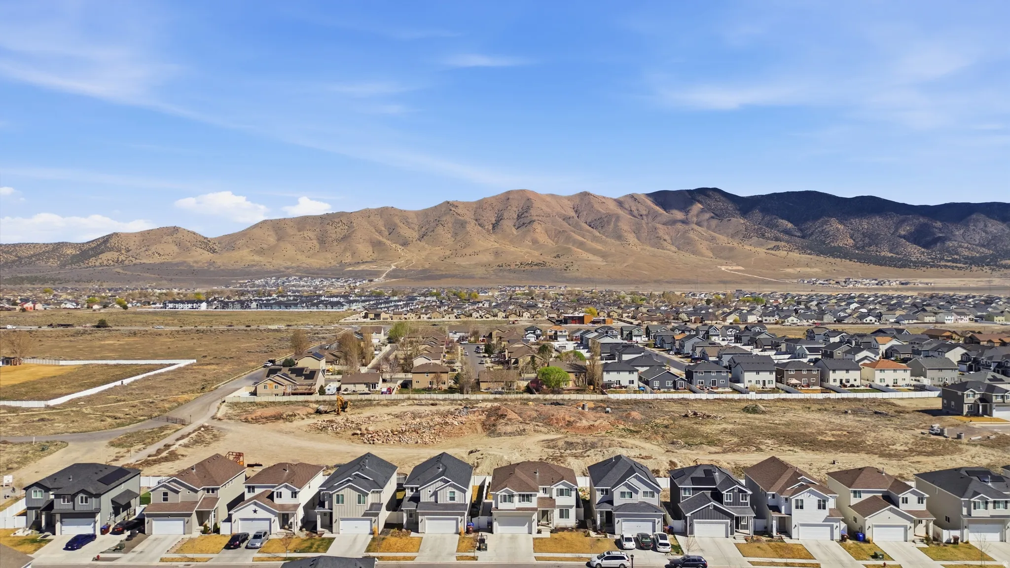 Aerial view of residential area with a mountainous background