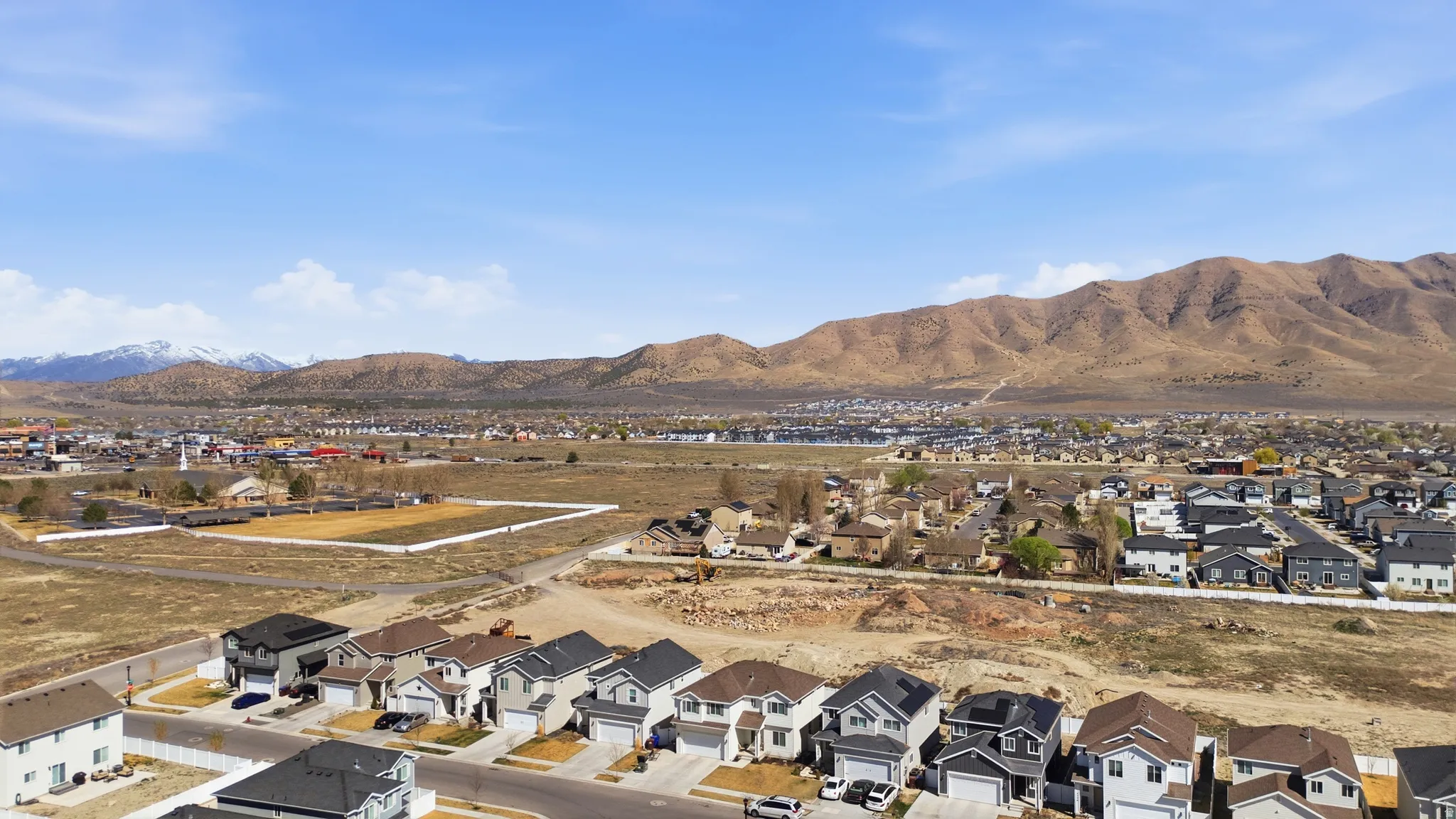 Aerial perspective of suburban area with mountains
