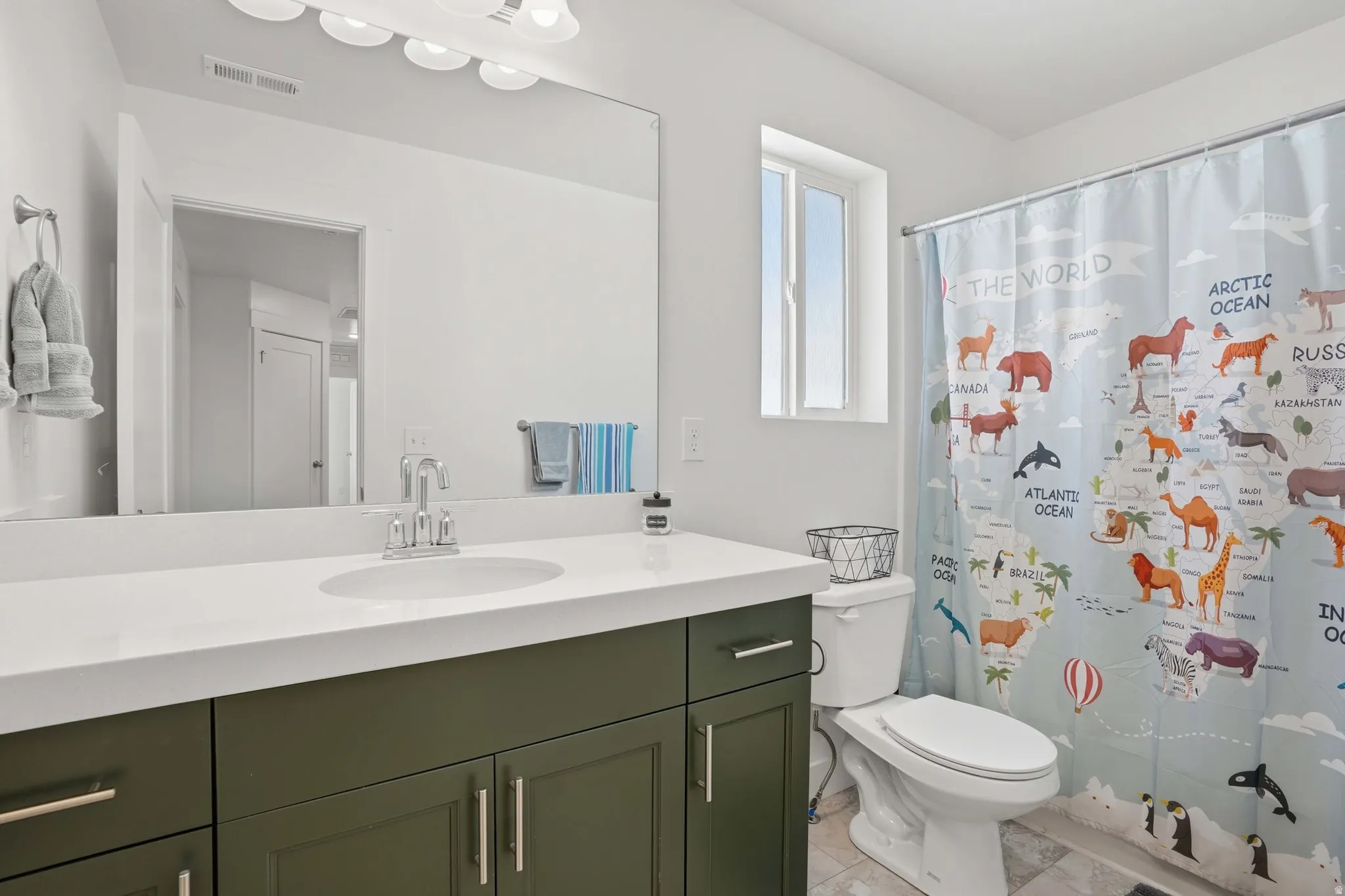 Full bath featuring vanity and a shower with curtain
