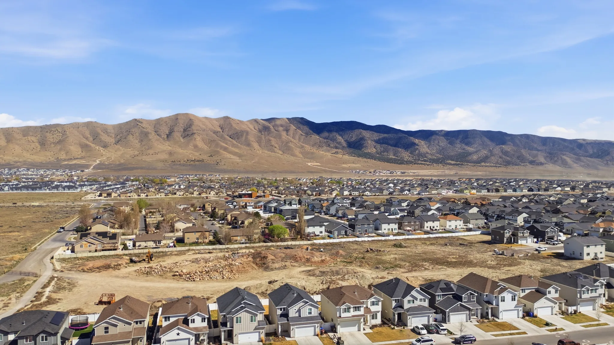 View of mountain background featuring nearby suburban area
