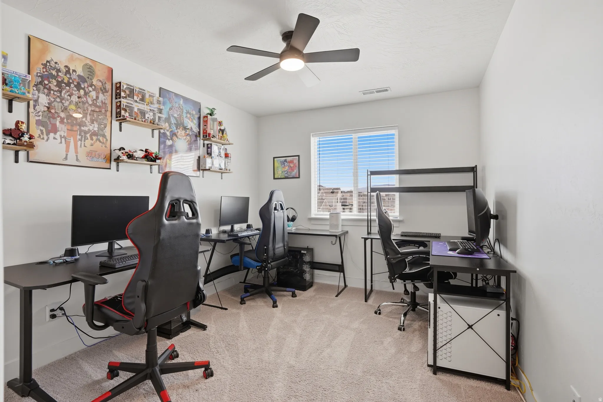 Office featuring light colored carpet and ceiling fan