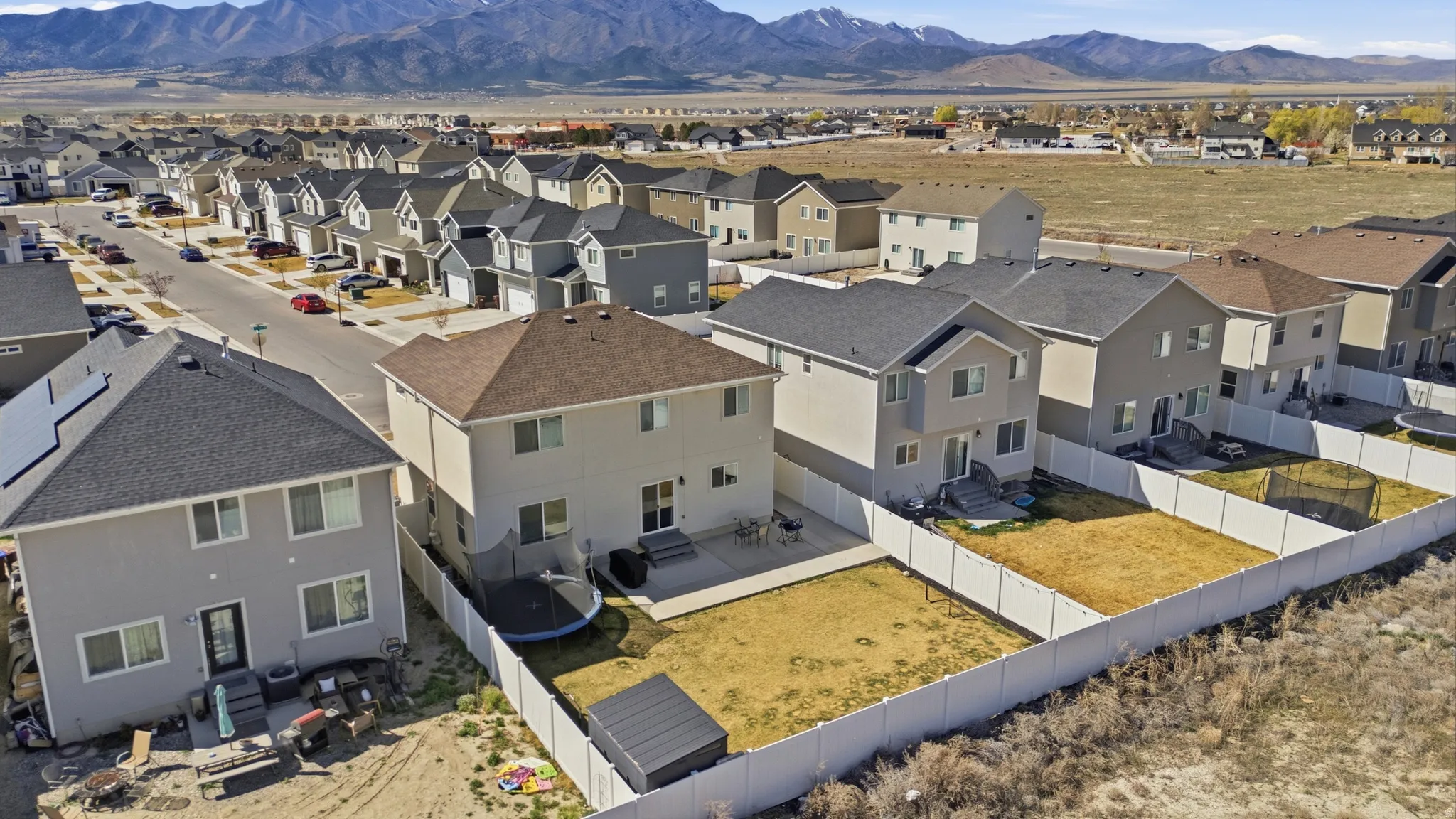 Aerial view of residential area with a mountainous background