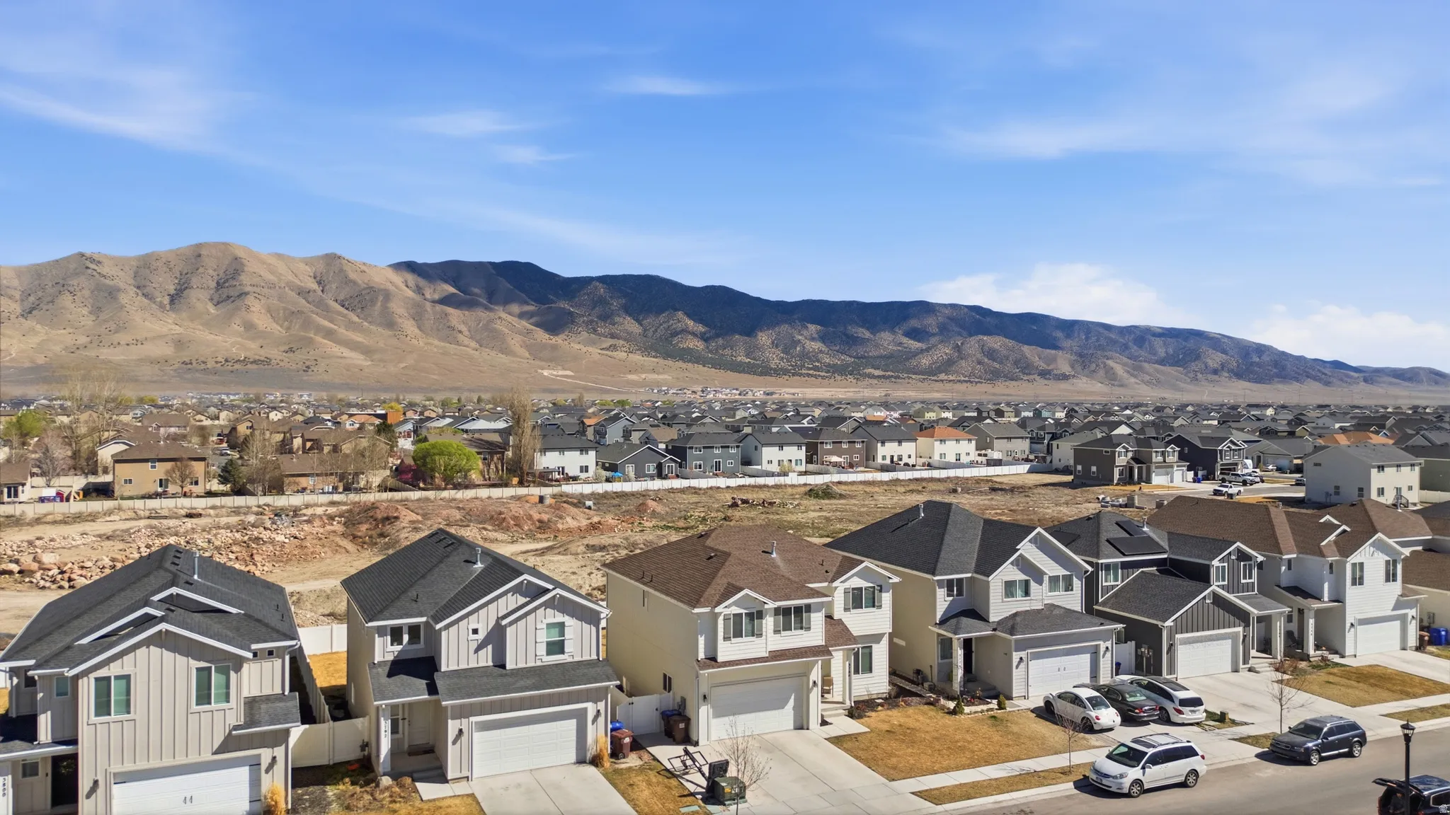View of mountain background featuring nearby suburban area