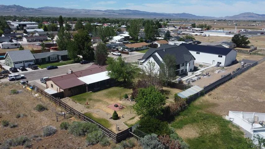 Expansive property featuring two distinct dwellings and a large open lot