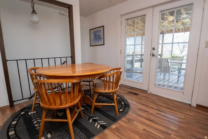 Dining space with wood finished floors and french doors