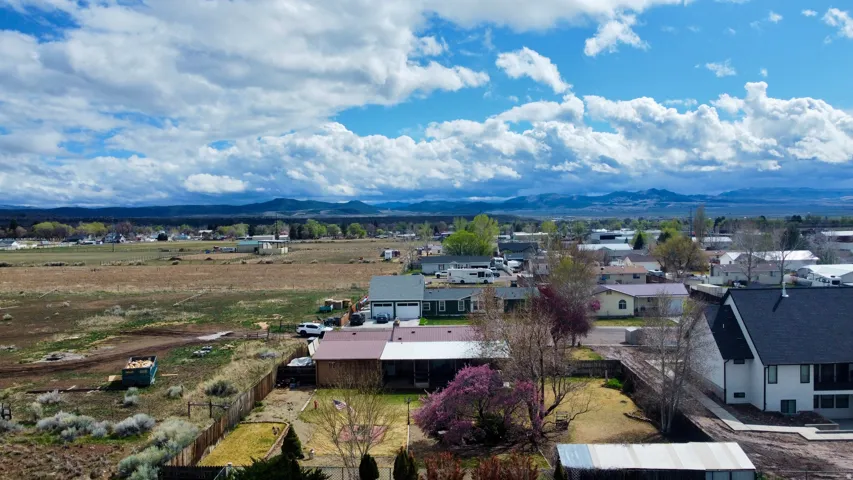 Aerial view of residential area with a mountainous background