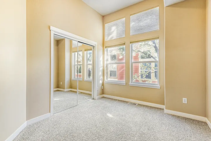 Second Bedroom w large windows and high ceilings