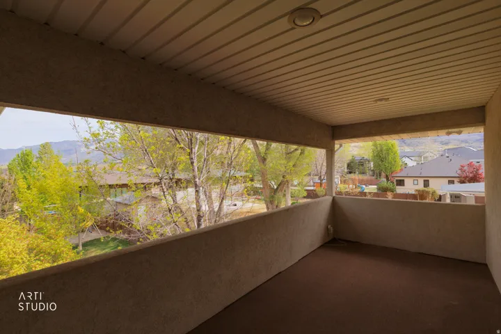 Balcony featuring a mountain view and a residential view