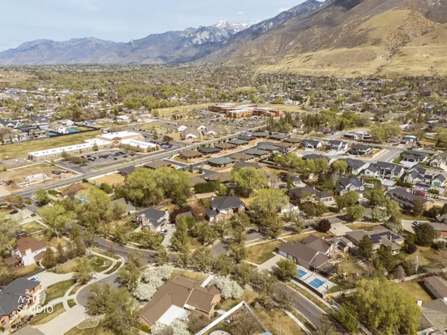 Aerial view of residential area featuring a mountainous background