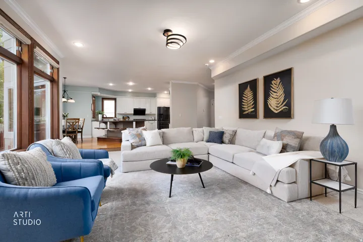 Living room featuring recessed lighting and ornamental molding