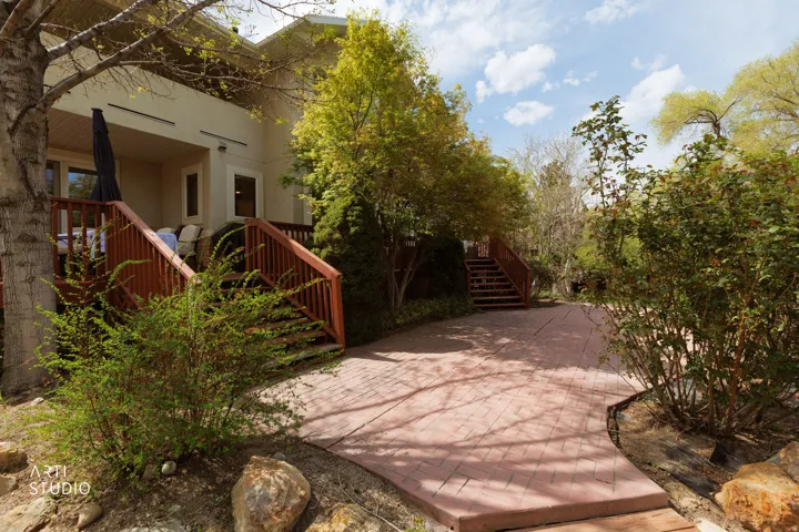 View of home's exterior with a patio and stucco siding