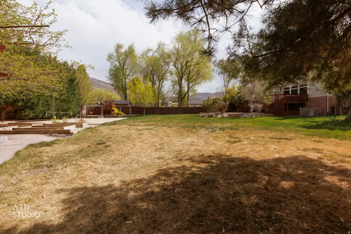 Fenced yard with a mountain view