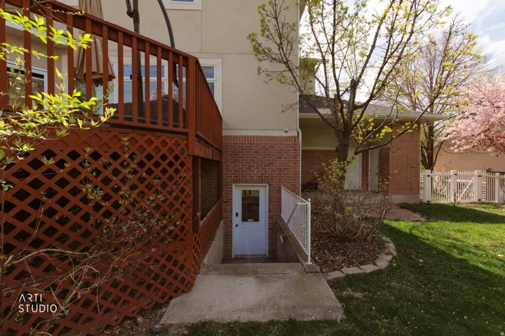 Entrance to property featuring brick siding and stucco siding