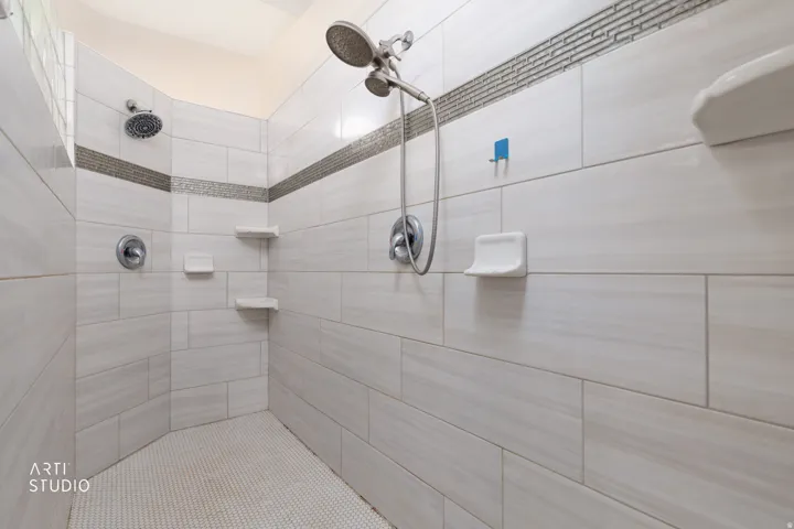 Full bath with tiled shower