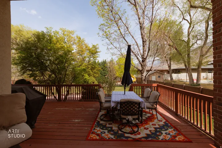 Wooden deck featuring outdoor dining space