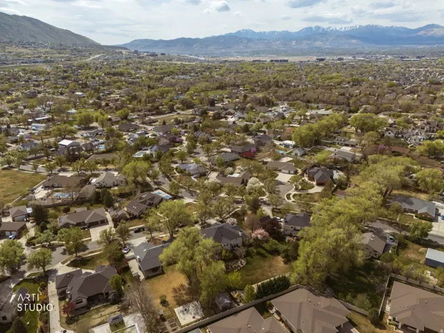 Aerial view of residential area featuring a mountain backdrop