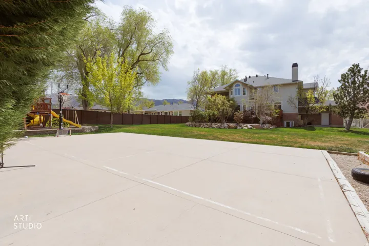 View of patio / terrace featuring a playground, a mountain view, and basketball court