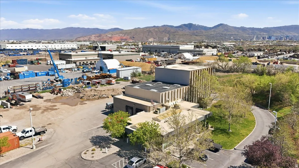 Bird's eye view of a mountain backdrop and industrial structures
